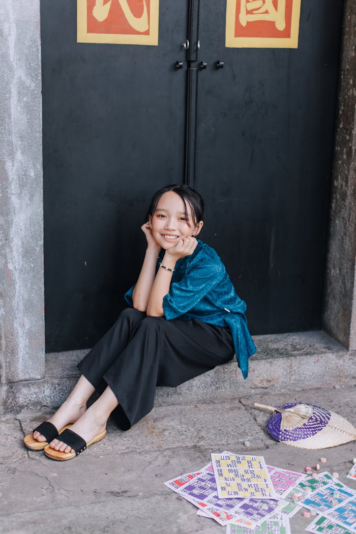 digital A young girl in traditional attire enjoying the Lunar New Year in Ho Chi Minh City, Vietnam.